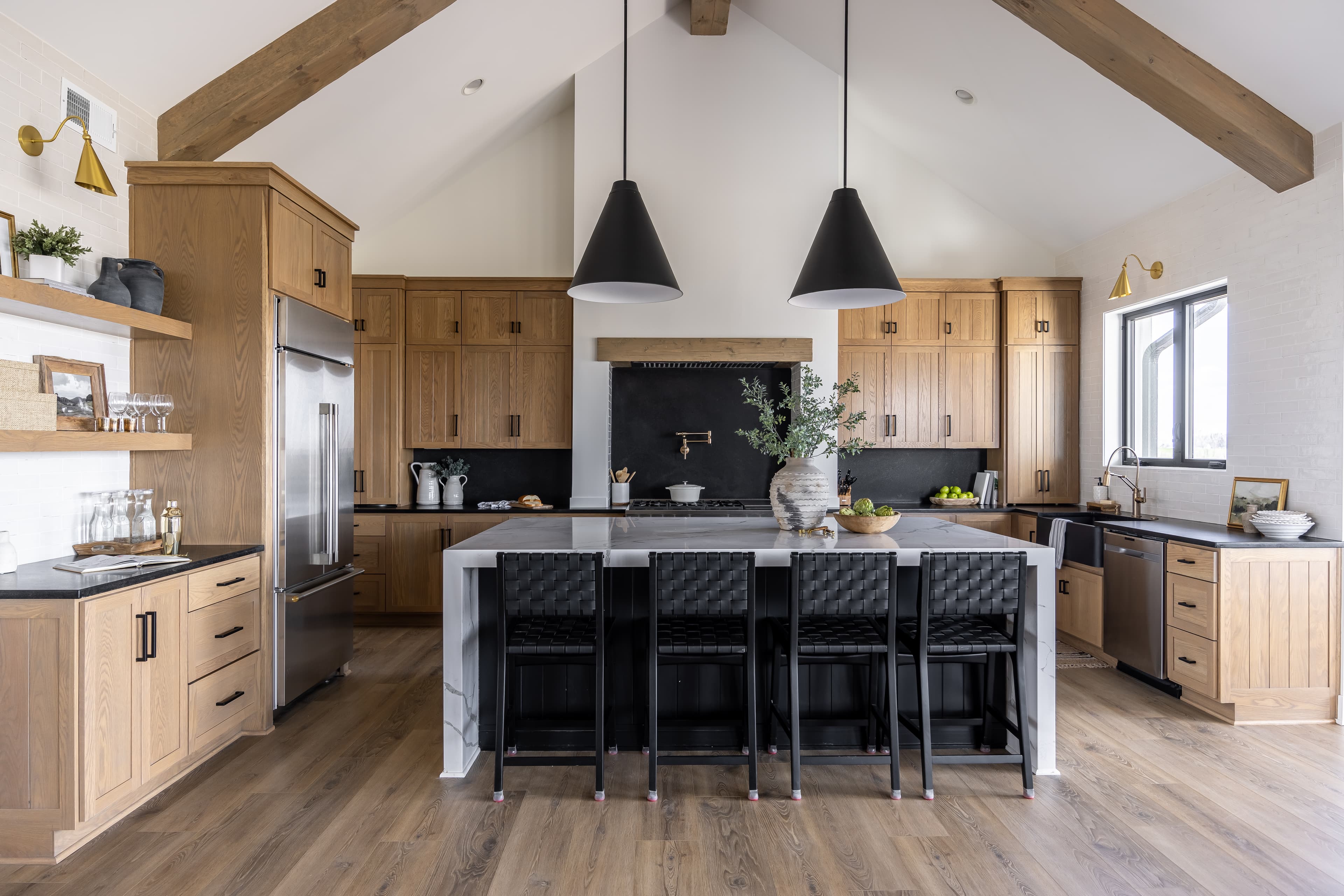 Interior design Sydney: kitchen with oak cabinetry, marble island, and black pendant lighting (placeholder)